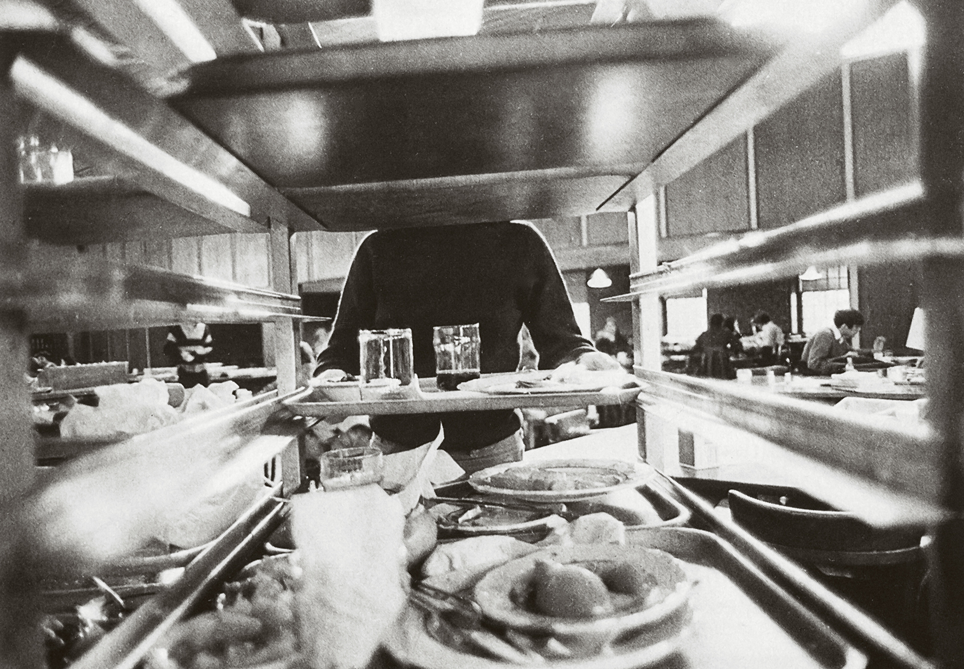 A student busses her tray at the Ratty